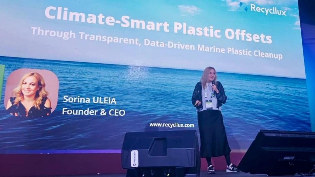 Sorina Uleia, Founder and CEO, pitching on stage at How to Web 2025 before a Climate-Smart Plastic Offsets slide