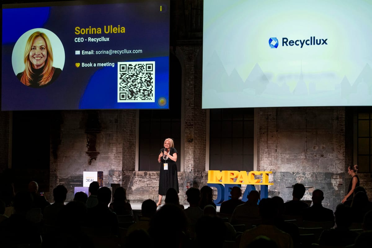 Speaker on stage at the Impact Deal Demo Day at OGR Torino below a screen reading Sorina Uleia, CEO Recycllux